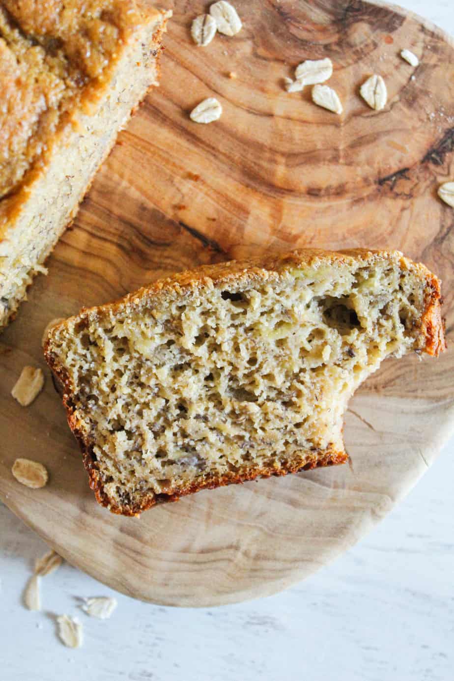 bite out of a slice of oat flour banana bread.
