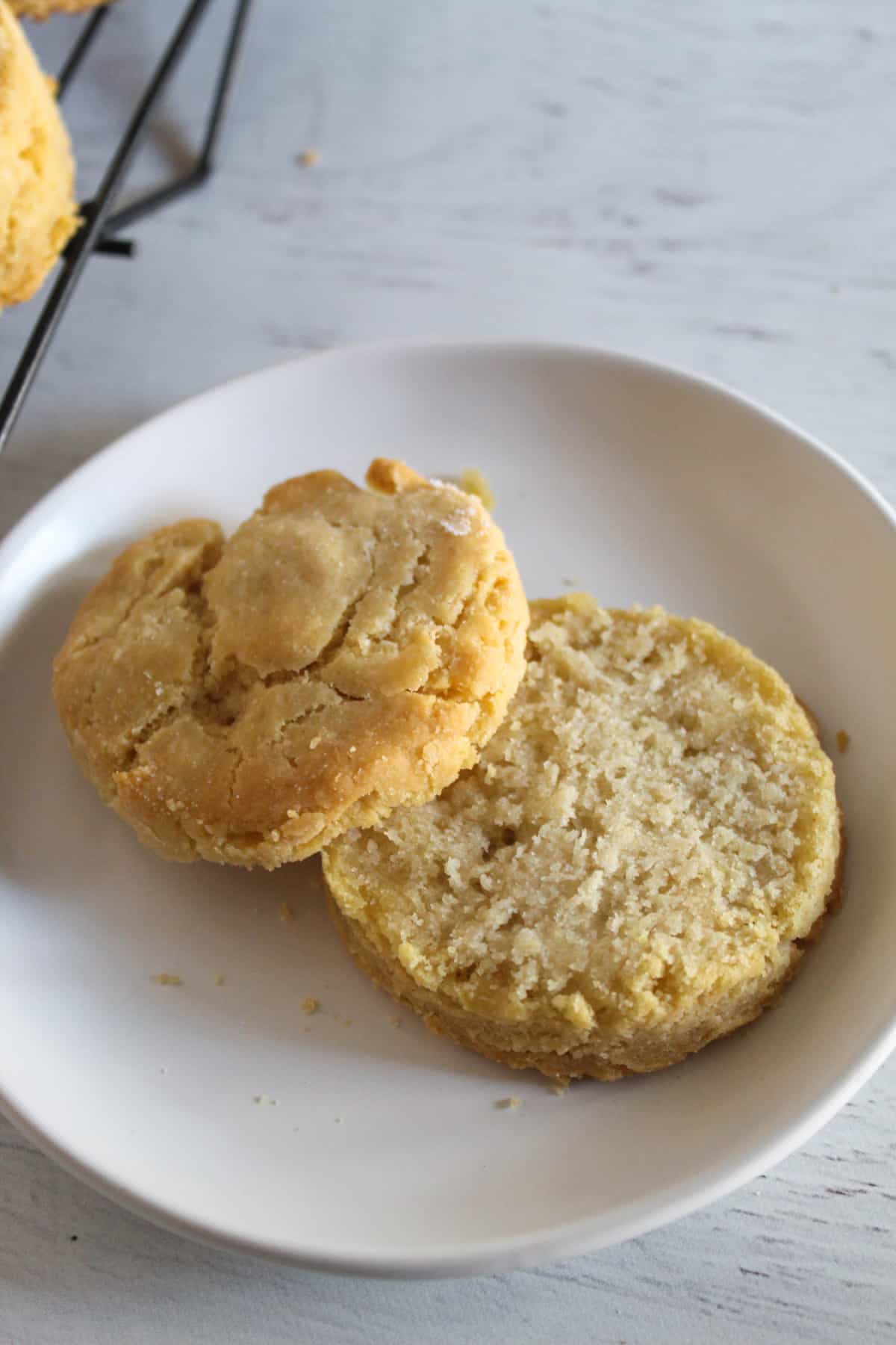 sliced biscuit sitting on a plate.