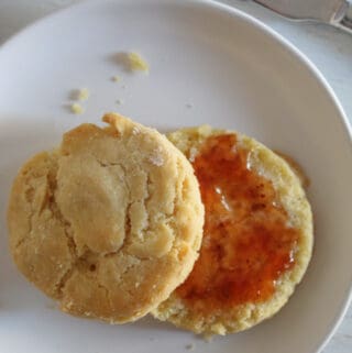 gluten free biscuits split topped with jelly.