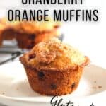 cranberry orange muffin on a white plate.
