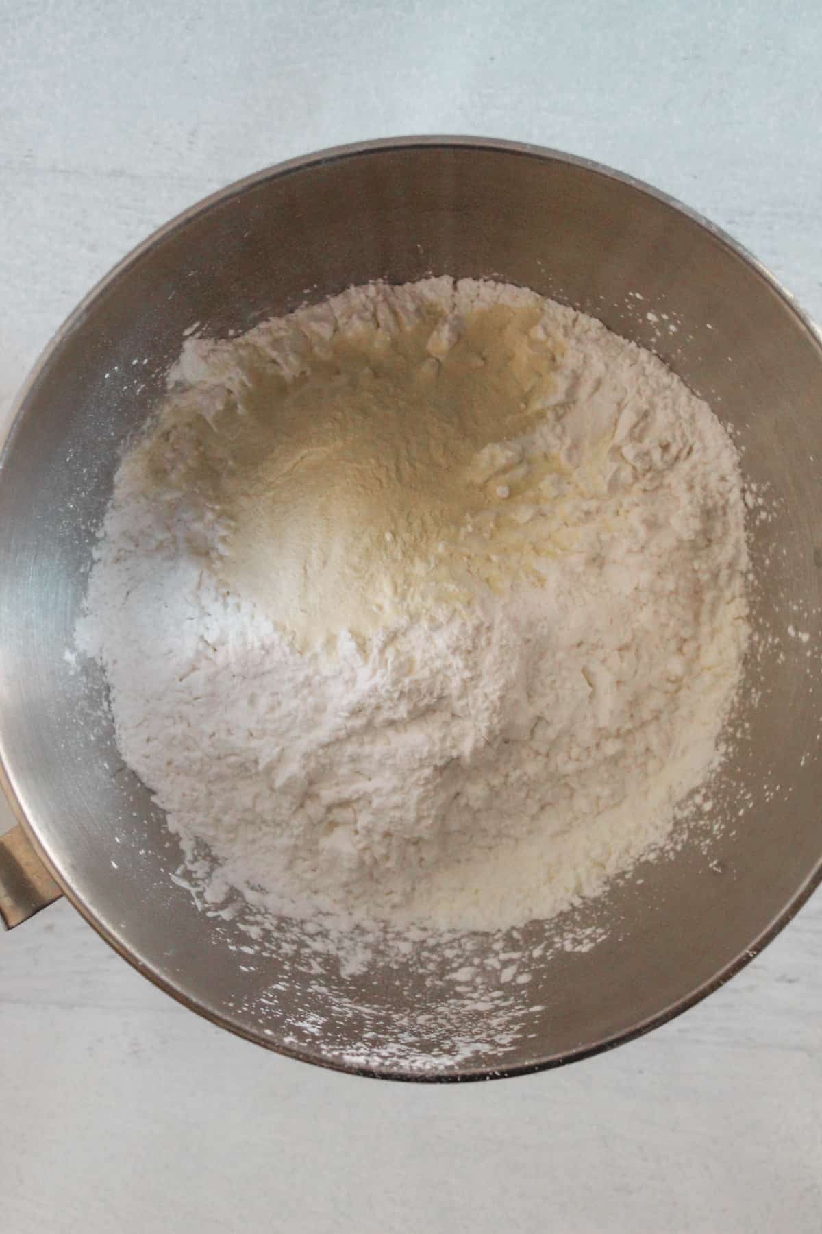 gluten free flours added to a mixing bowl.