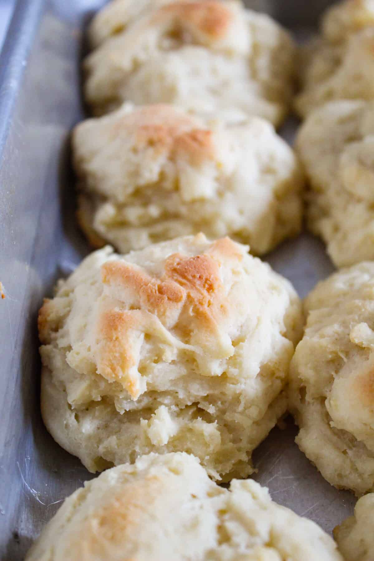 baked gluten free potato buns in a baking pan.
