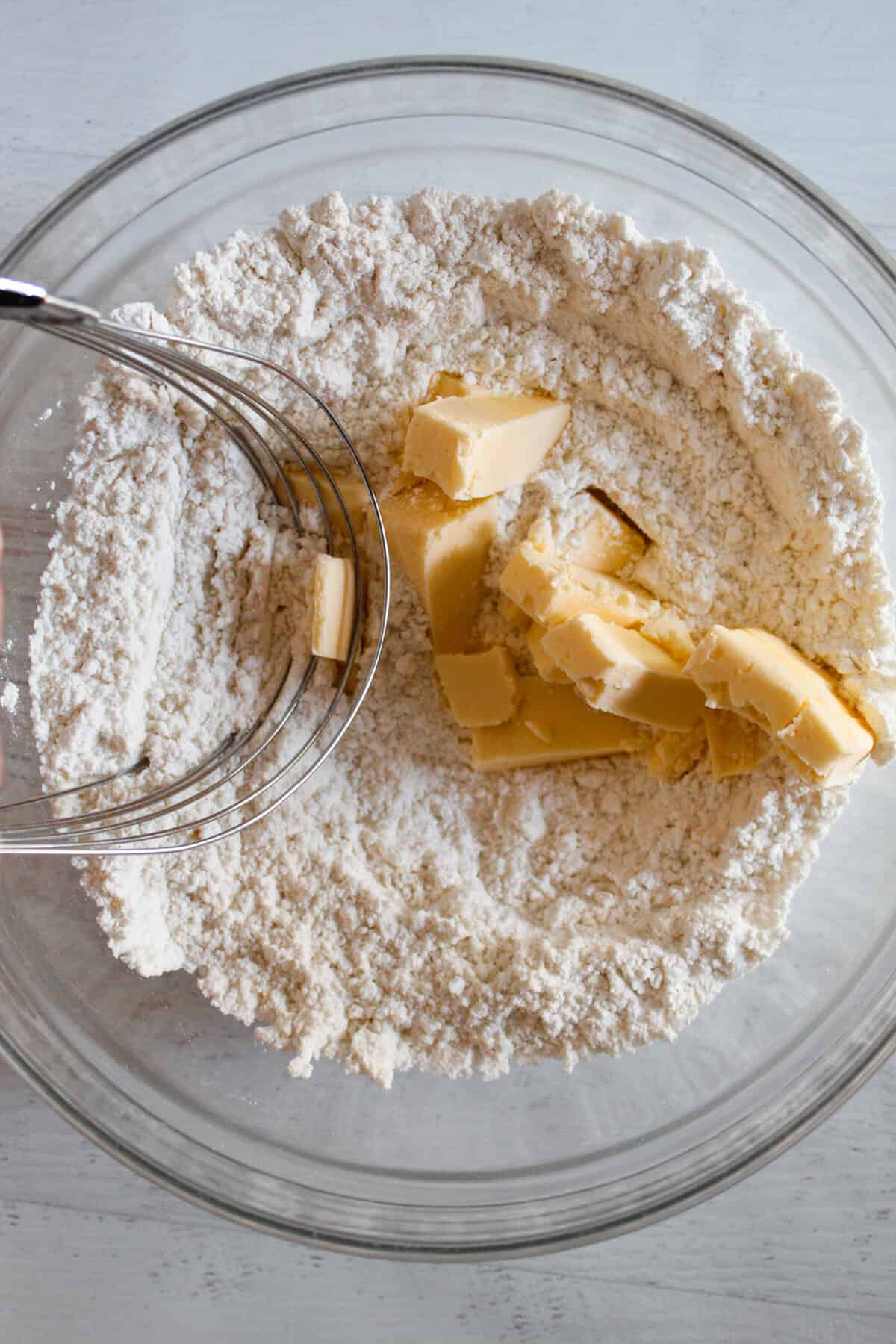 Using a pastry blender to cut butter into a dry ingredient mix