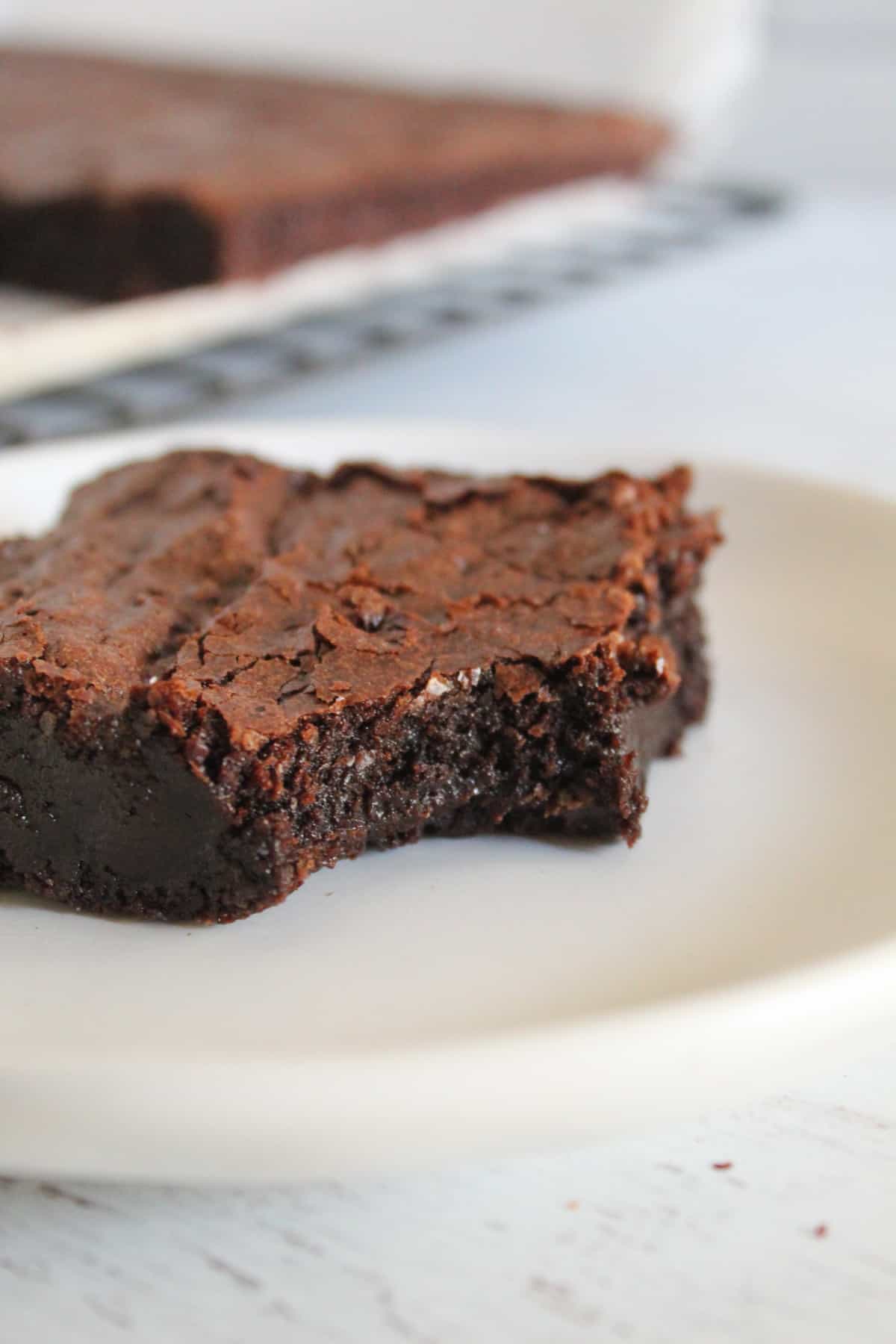 piece of flourless chocolate brownie on a plate.