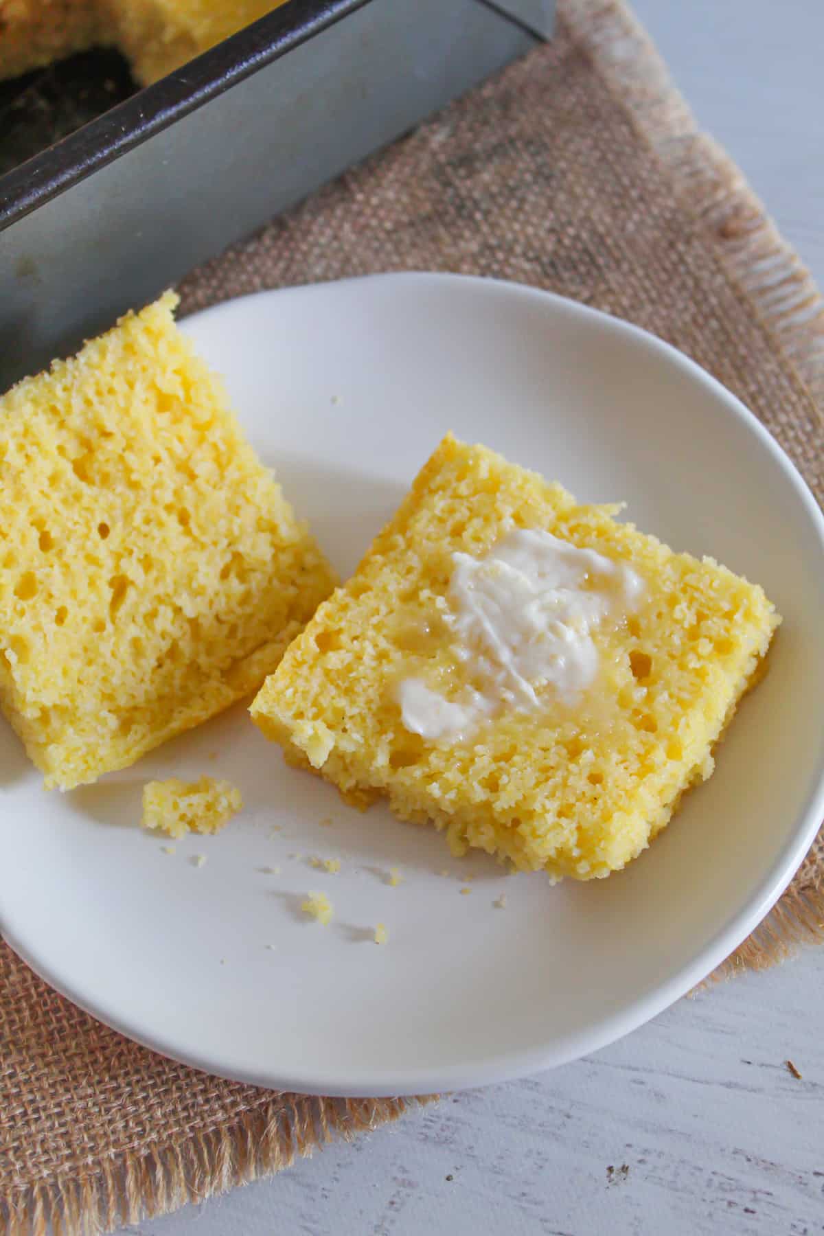 gluten free cornbread slice with butter inside.