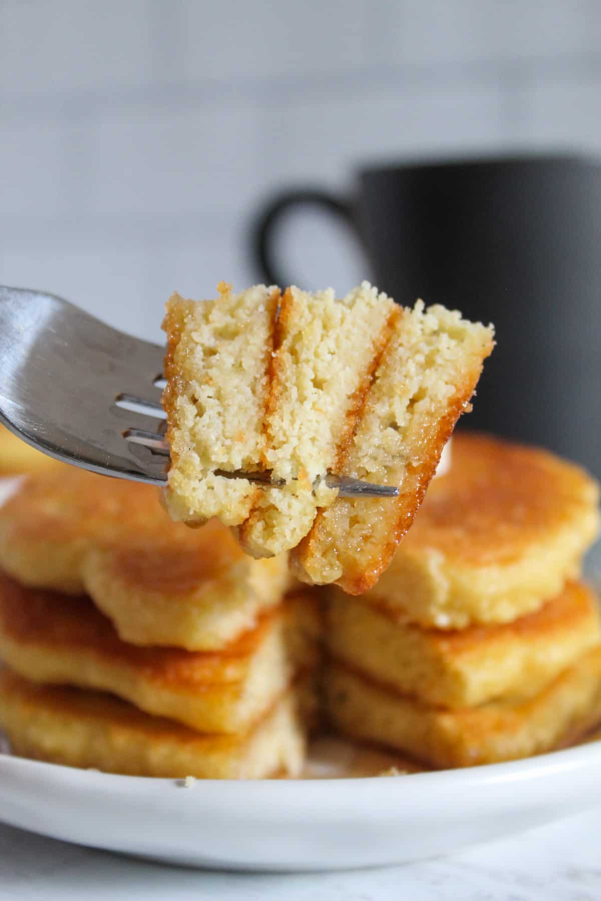 bite of almond flour pancakes on a fork.