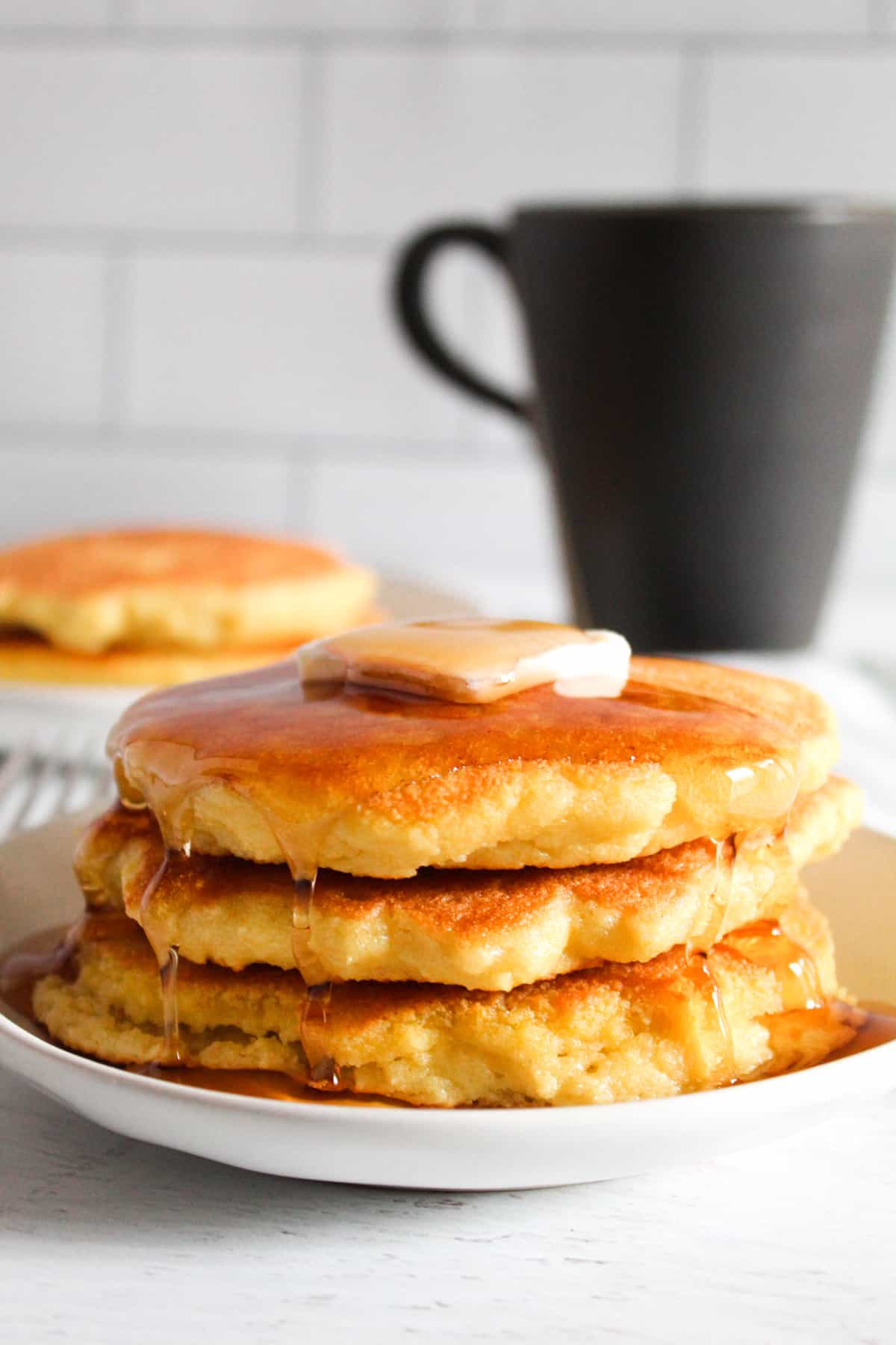 stack of pancakes on a plate.