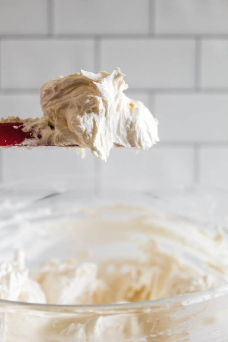 dollop of lemon buttercream on a spatula.