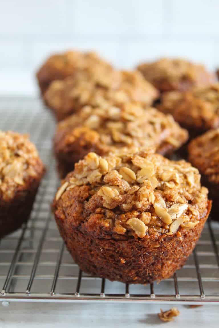 banana oatmeal muffin sitting on a wire rack.