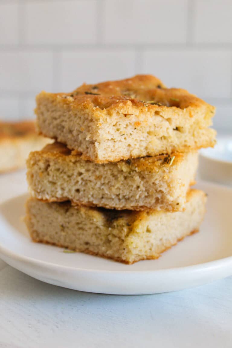 stack of focaccia bread on a white plate.