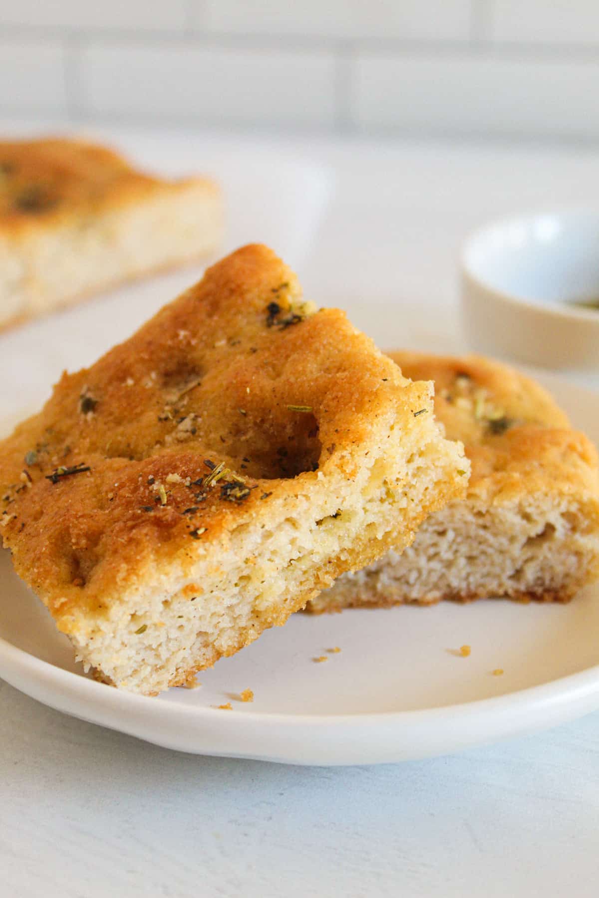 slices of focaccia bread on a white plate.