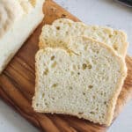slices of gluten free yeast free bread on a cutting board.