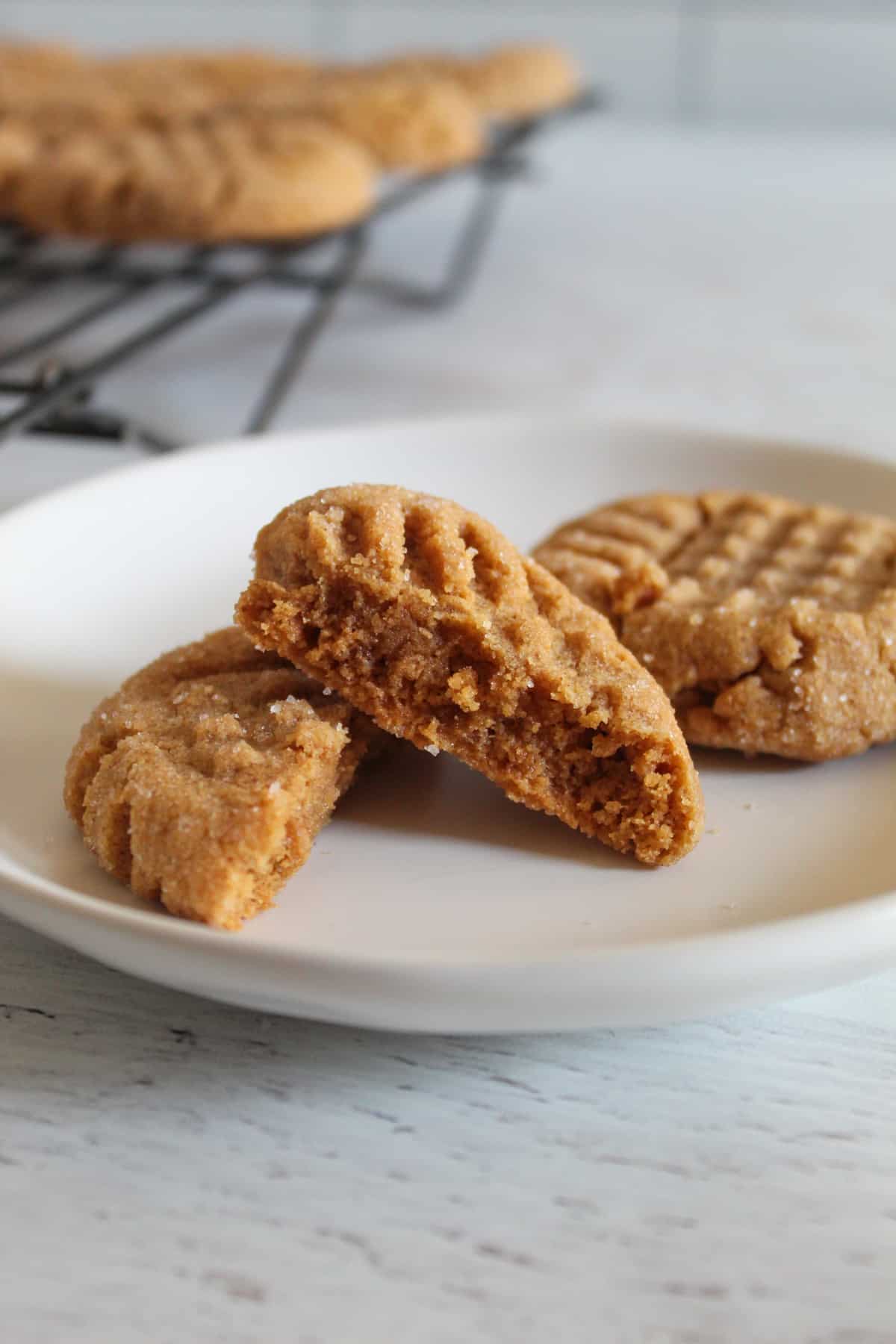 peanut butter cookies on a white plate.