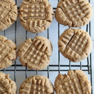 flourless peanut butter cookies on a wire rack.