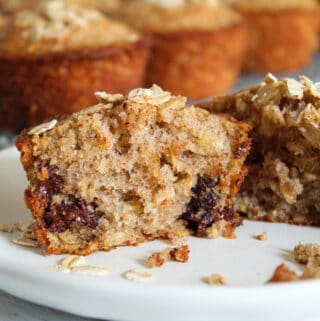 inside of an oatmeal chocolate chip muffin on a plate.