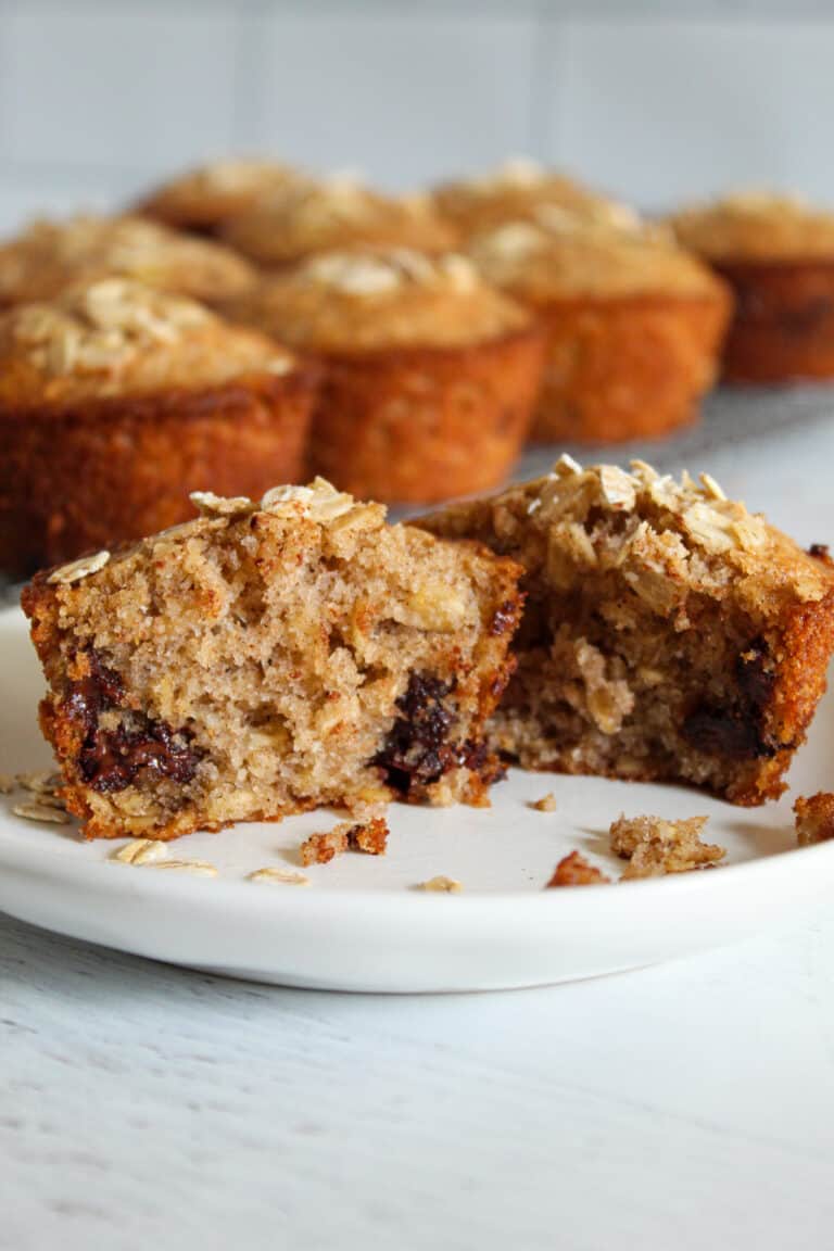 inside of an oatmeal chocolate chip muffin on a plate.