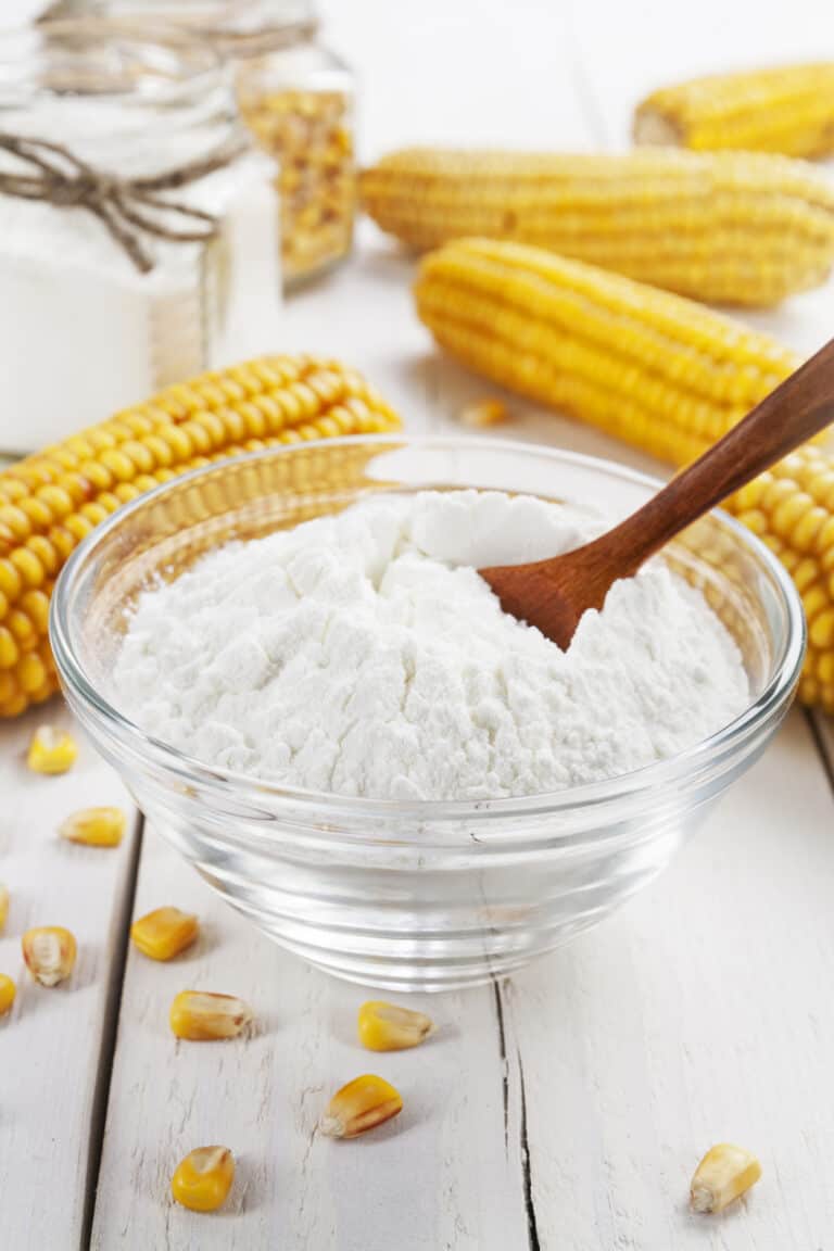 glass bowl of corn flour on a counter.