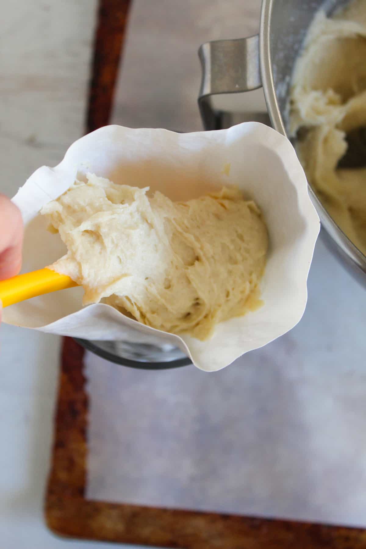 placing bread dough in a pastry bag