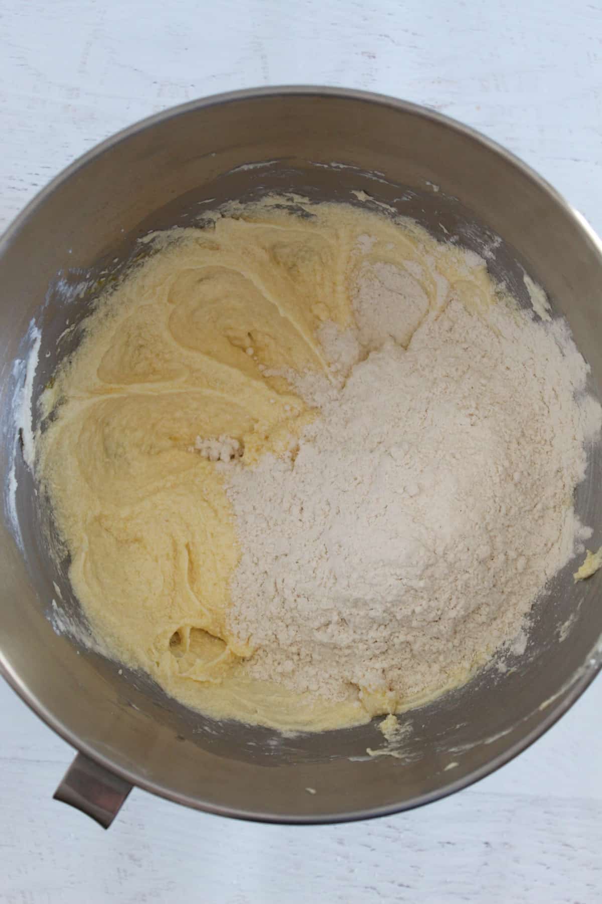 adding flour to cookie dough