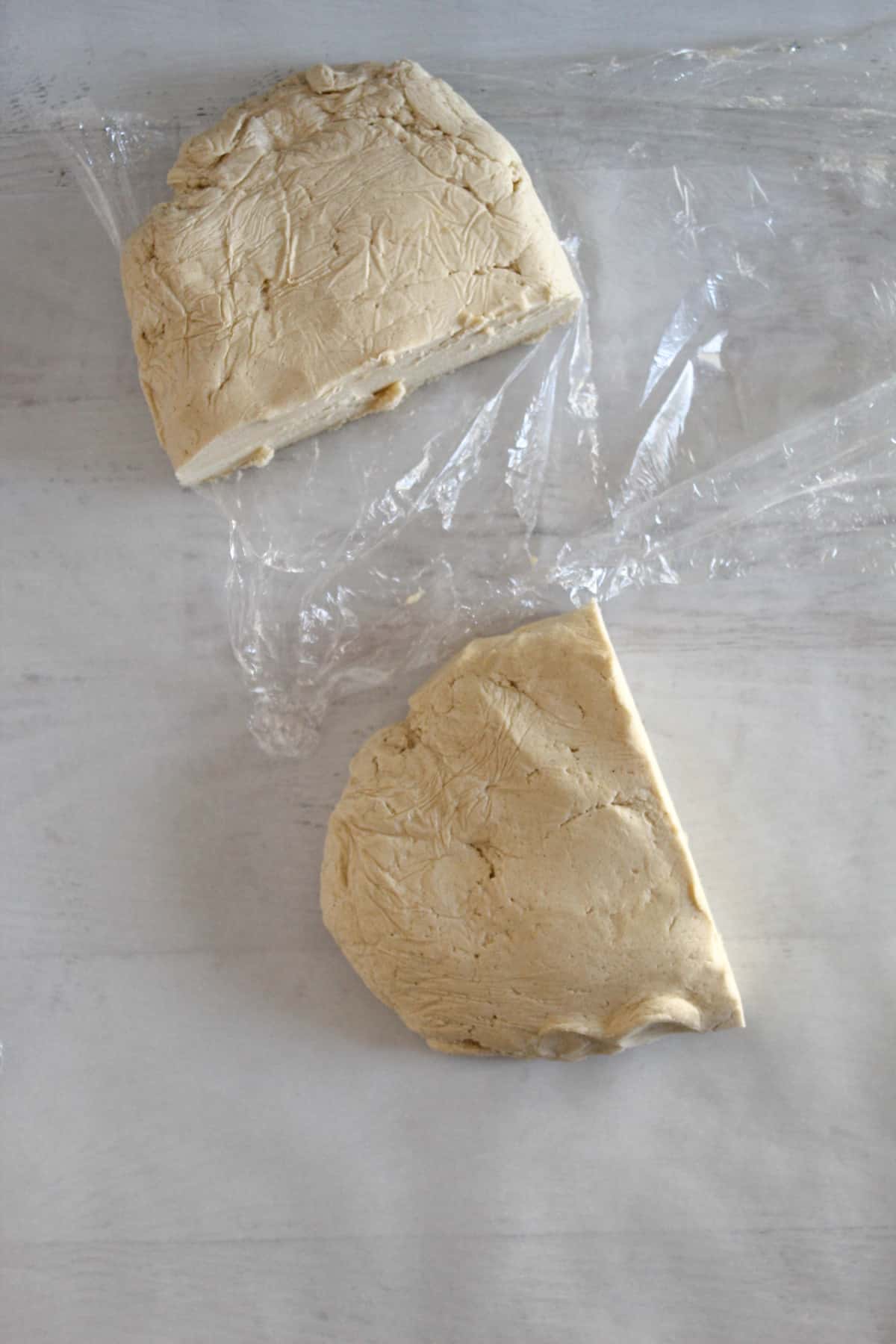 cutting refrigerated cookie dough in half
