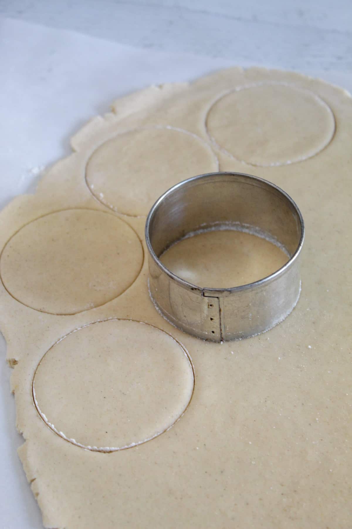 cookie cutter on rolled cookie dough