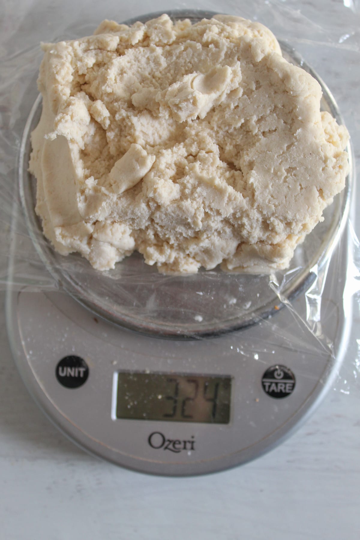 pie crust dough weighed on a scale