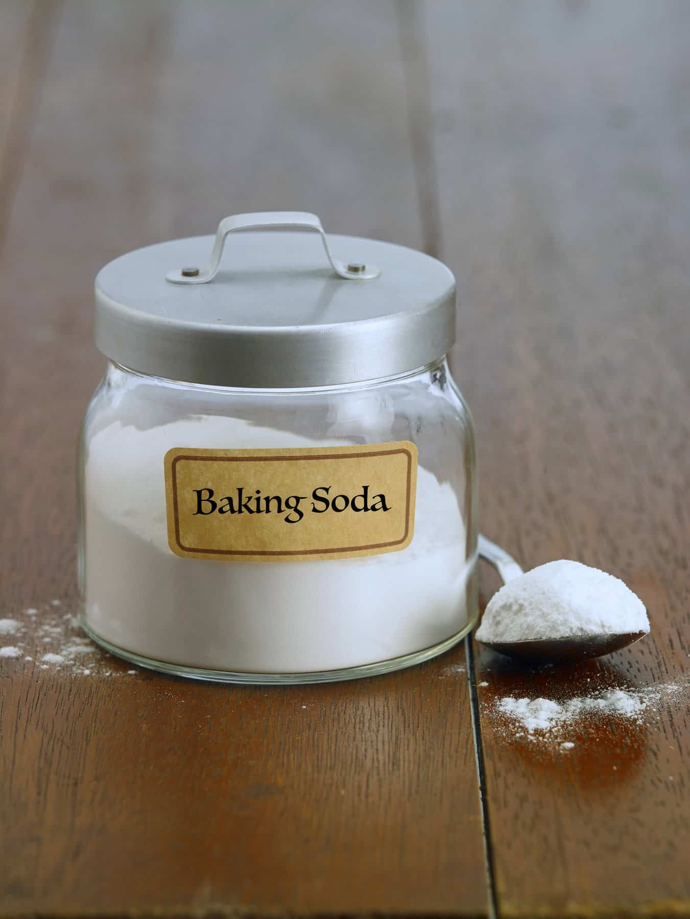 jar of baking soda on a table.