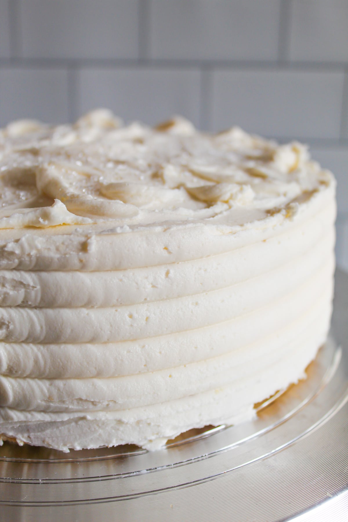 two layer gluten free white cake recipe decorated with buttercream.