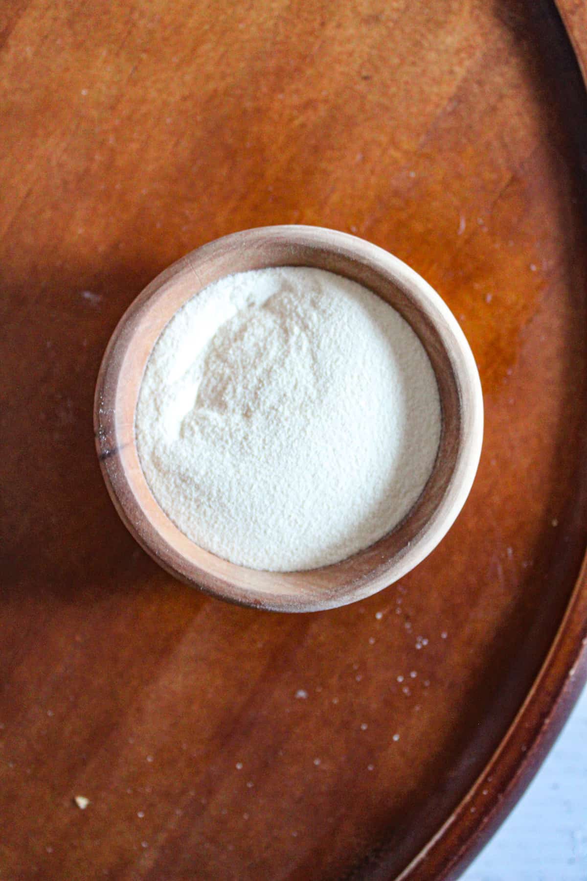 wooden bowl of xanthan gum