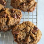 up close shot of chocolate chip cookies on a wire rack