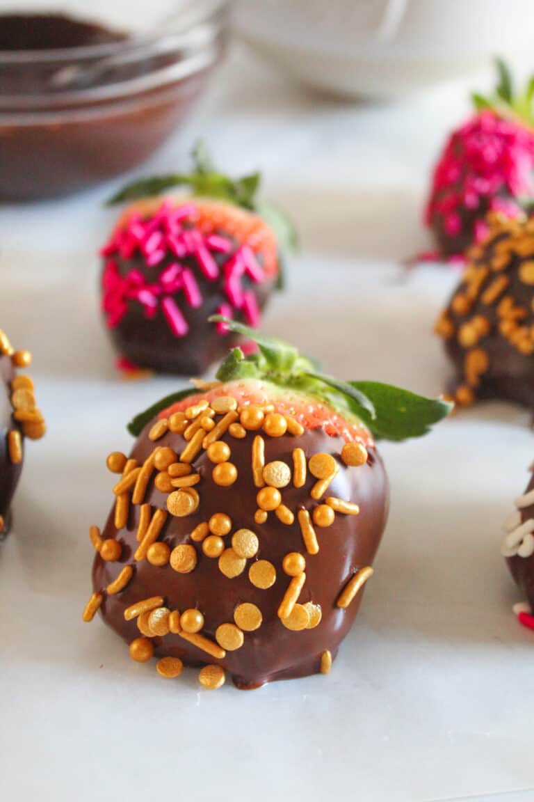 chocolate covered strawberries on a piece of wax paper