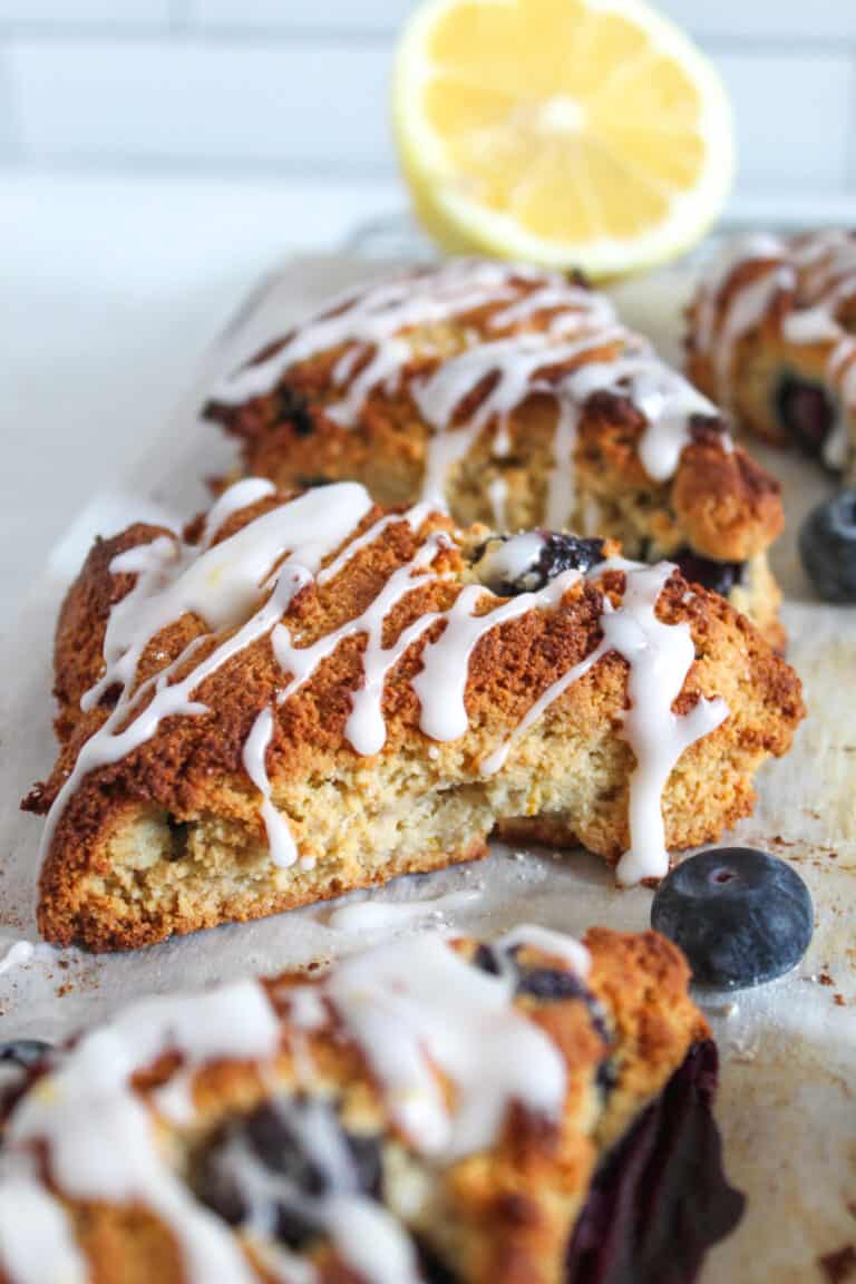 side shot of baked scones with glaze