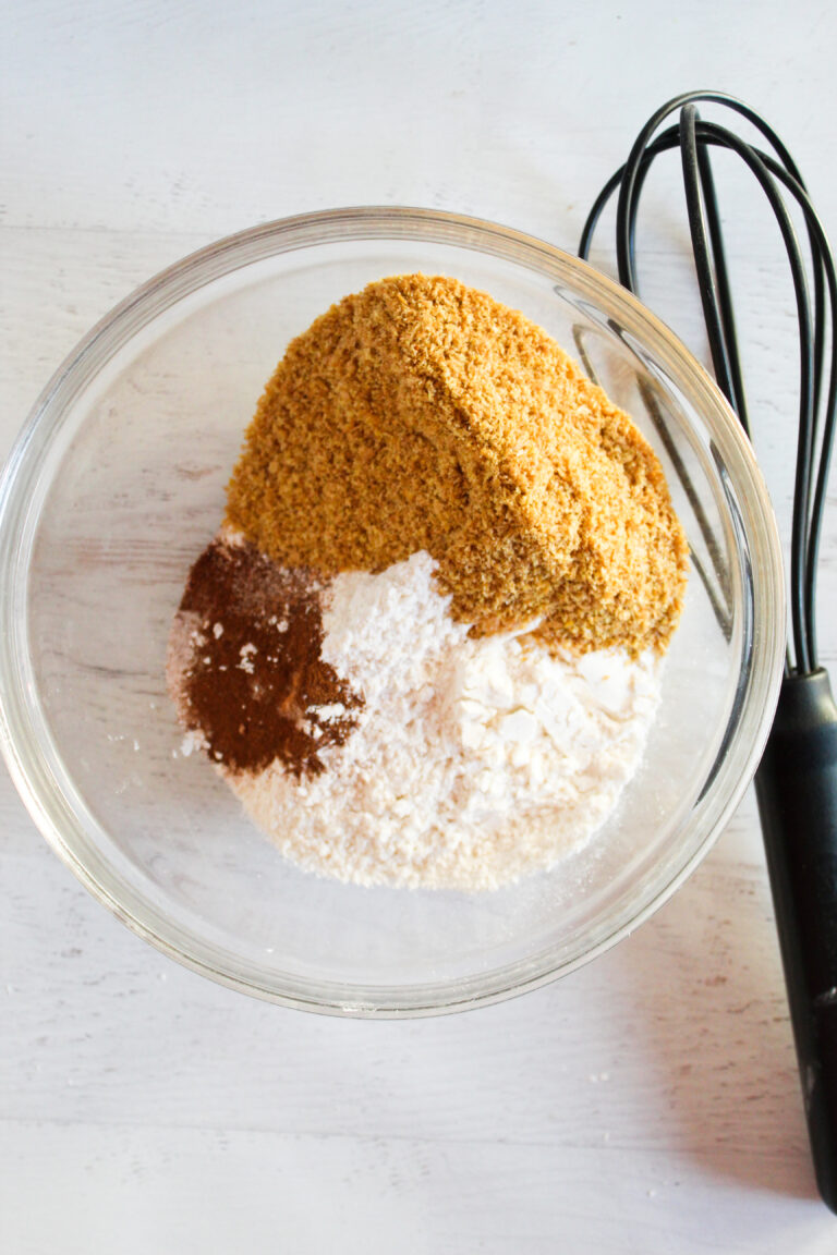 bowl of flax seed meal with a black whisk