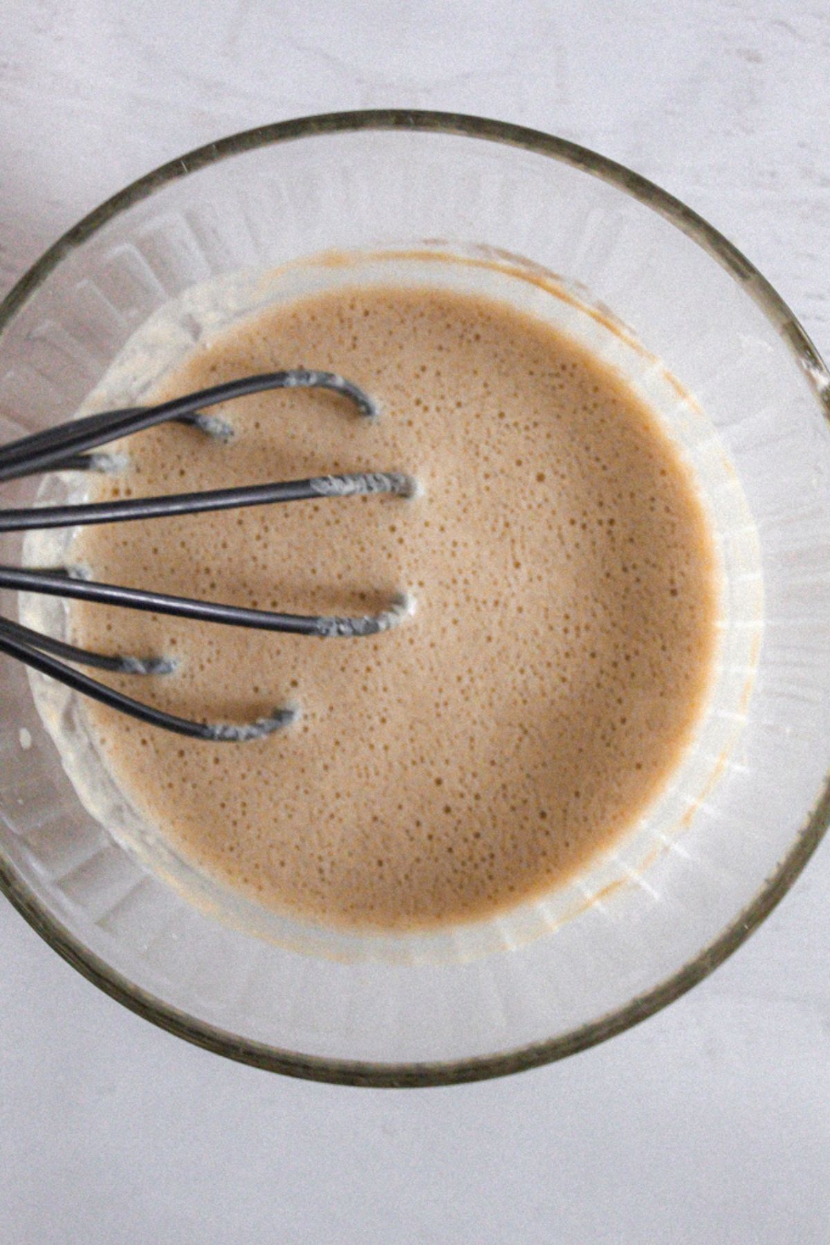 crepe batter in a glass bowl