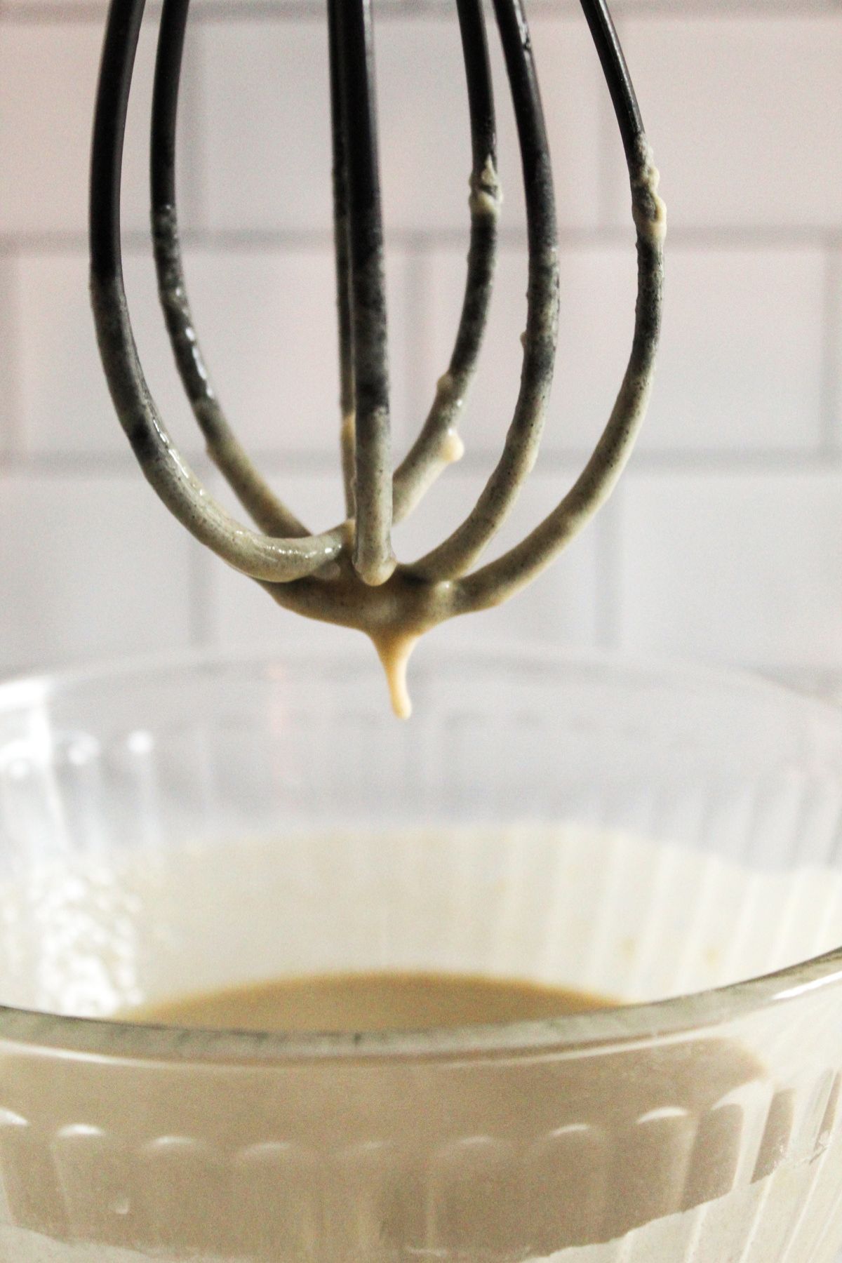 black whisk in crepe batter