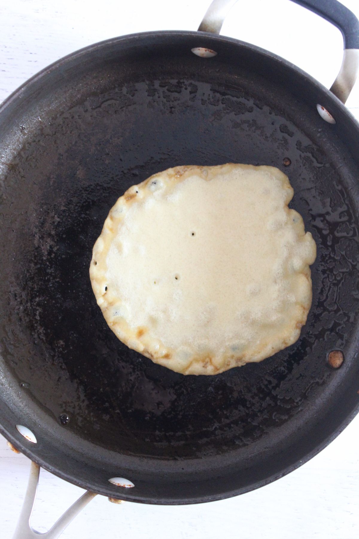 cooking crepes in a skillet