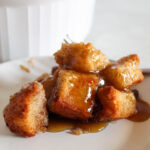 serving of gluten free bread pudding on a plate.