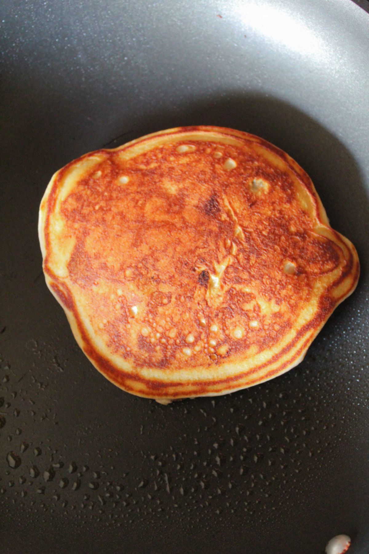 pancake flipped in a skillet