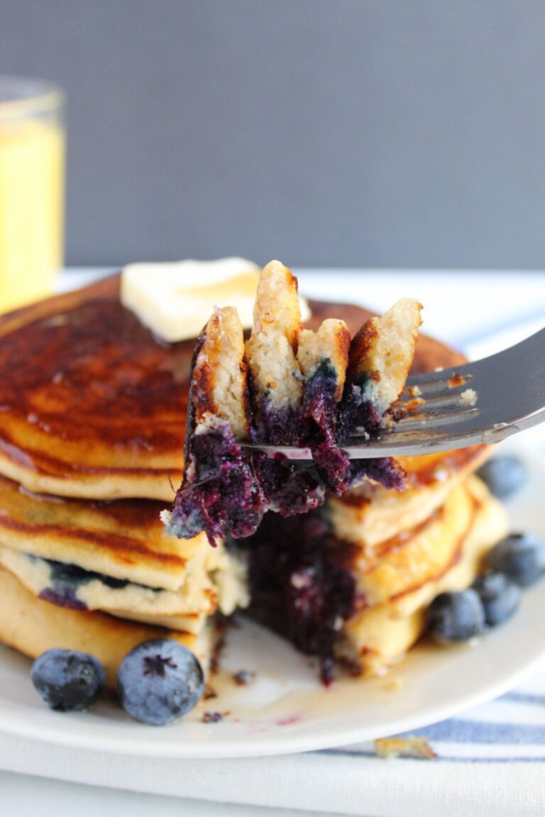 fork with a bite of pancakes on it