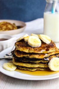 stack of pancakes on a white plate