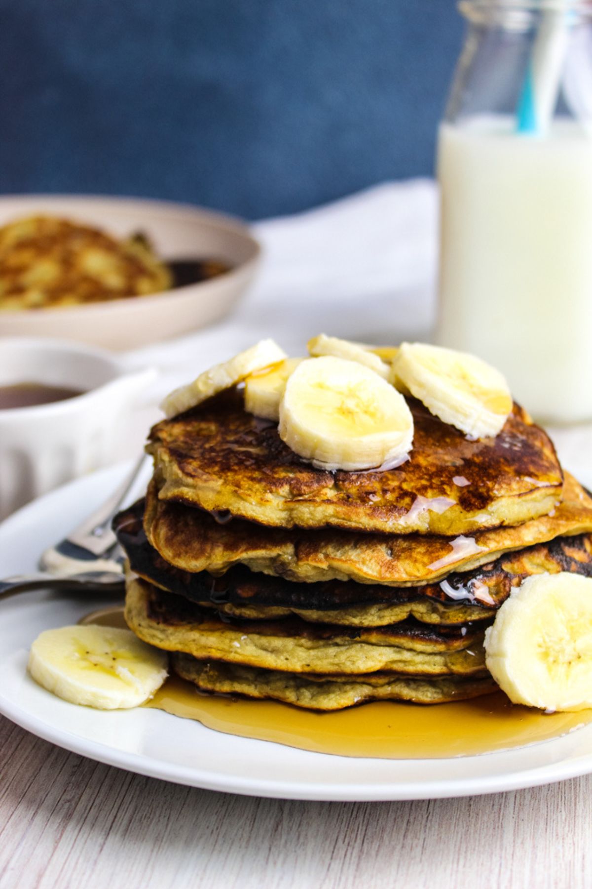 stack of pancakes on a white plate