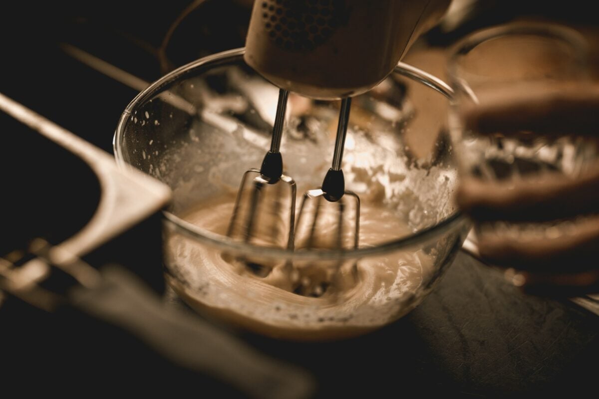 Mixing bowl with batter and mixer. 