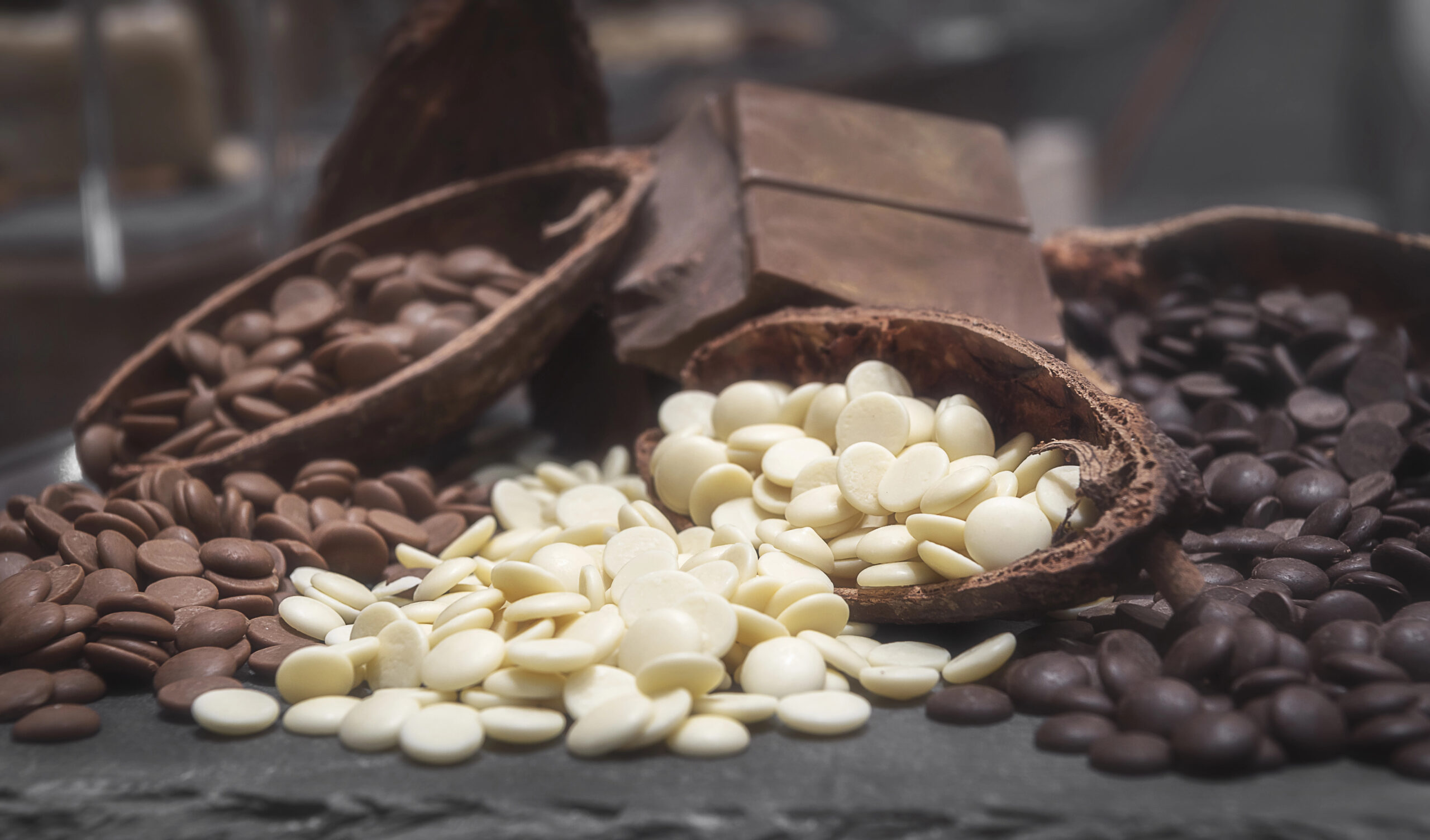 Variety of chocolate chips. White, milk and dark chocolate chips.