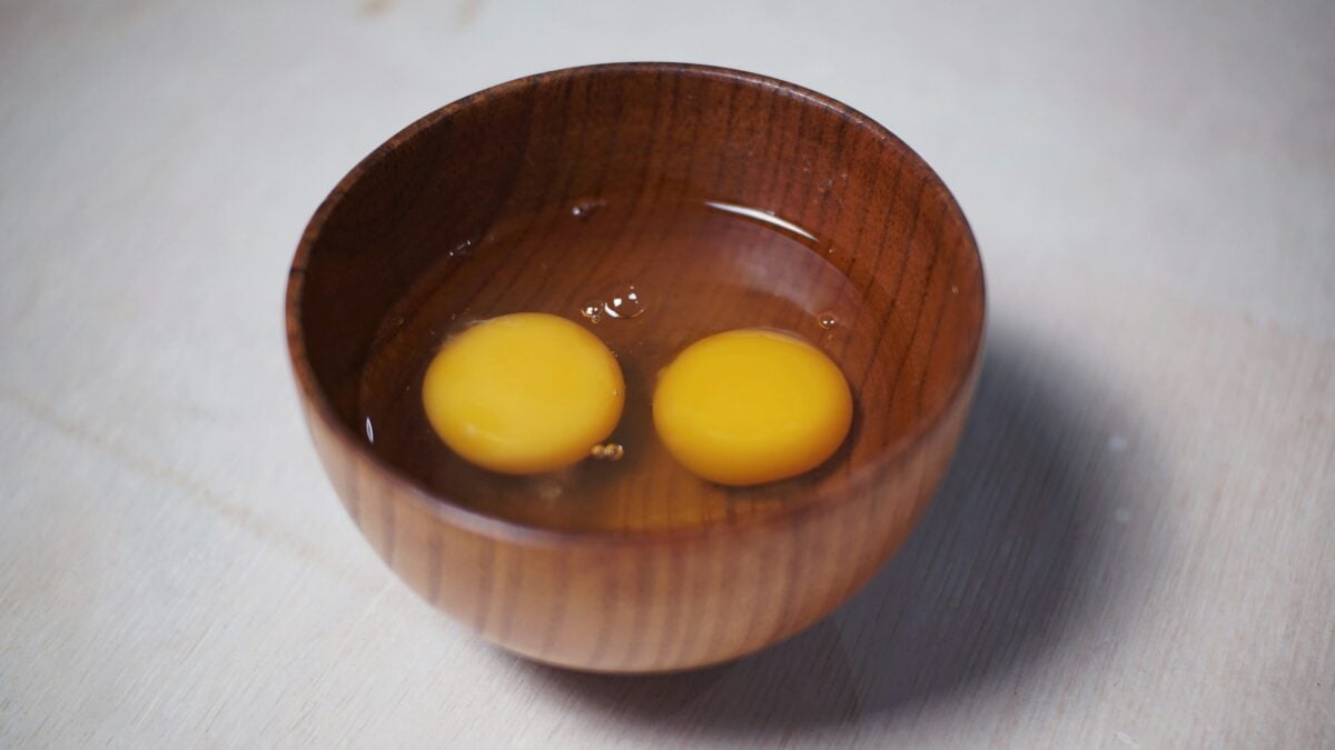 two eggs in a wooden bowl