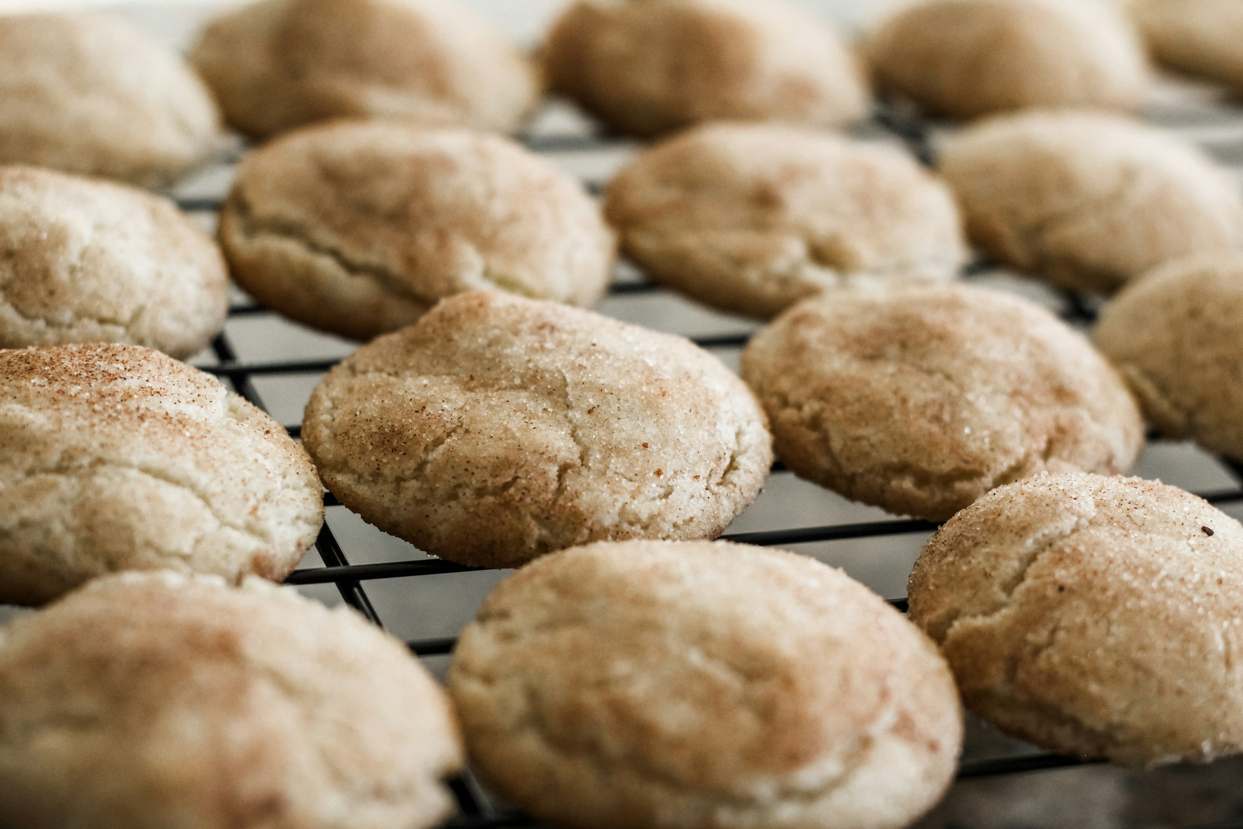Snickerdoodle cookies on a cooling rack