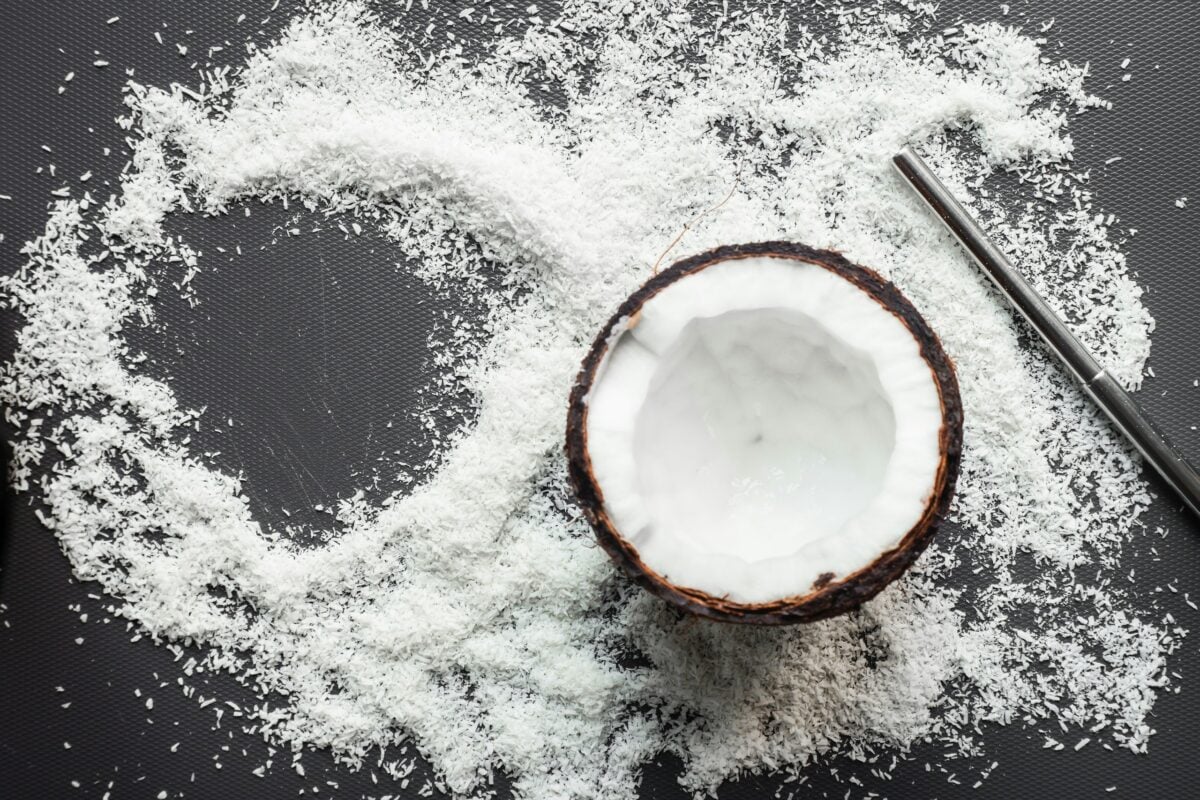 Half a coconut on top of shredded coconut