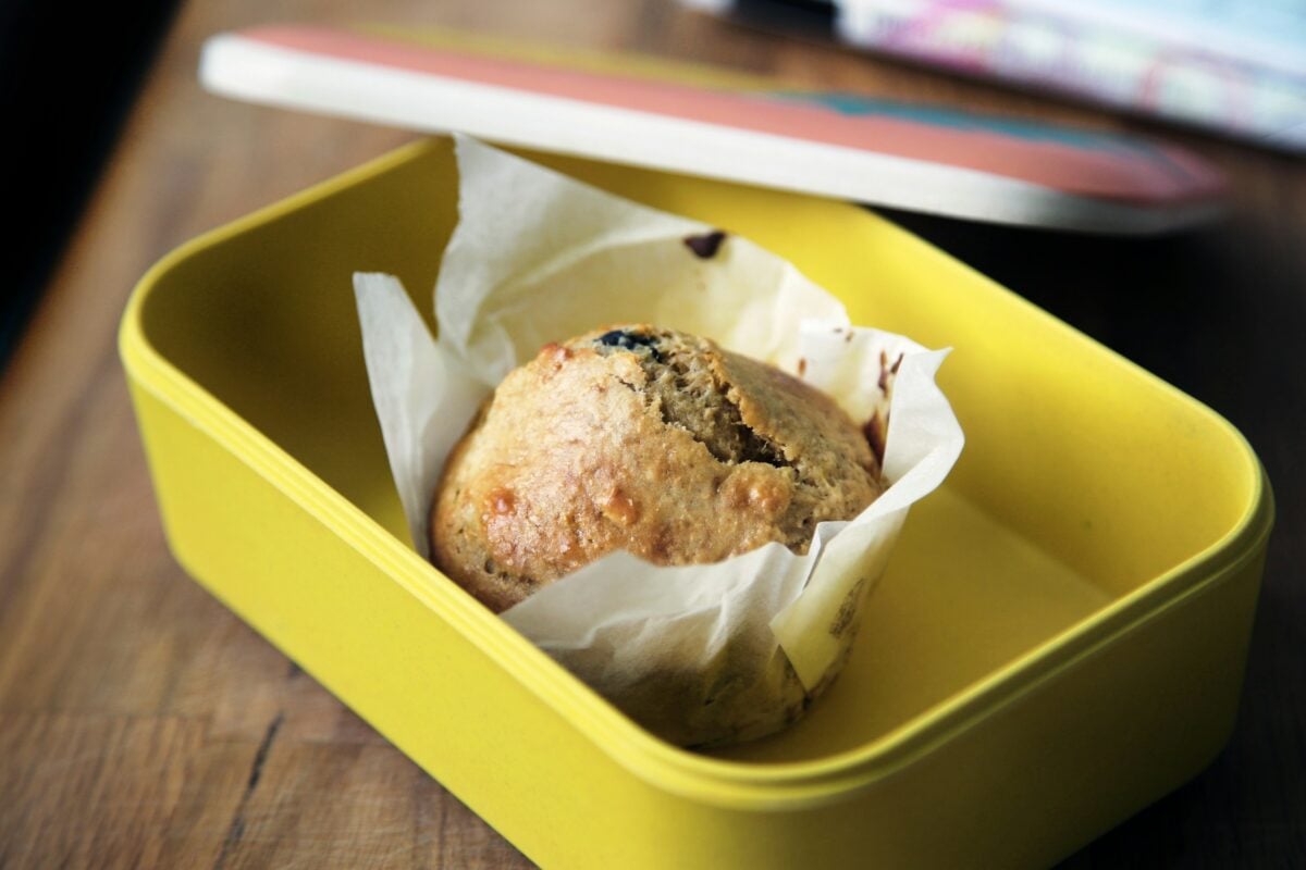 muffin in yellow plastic container
